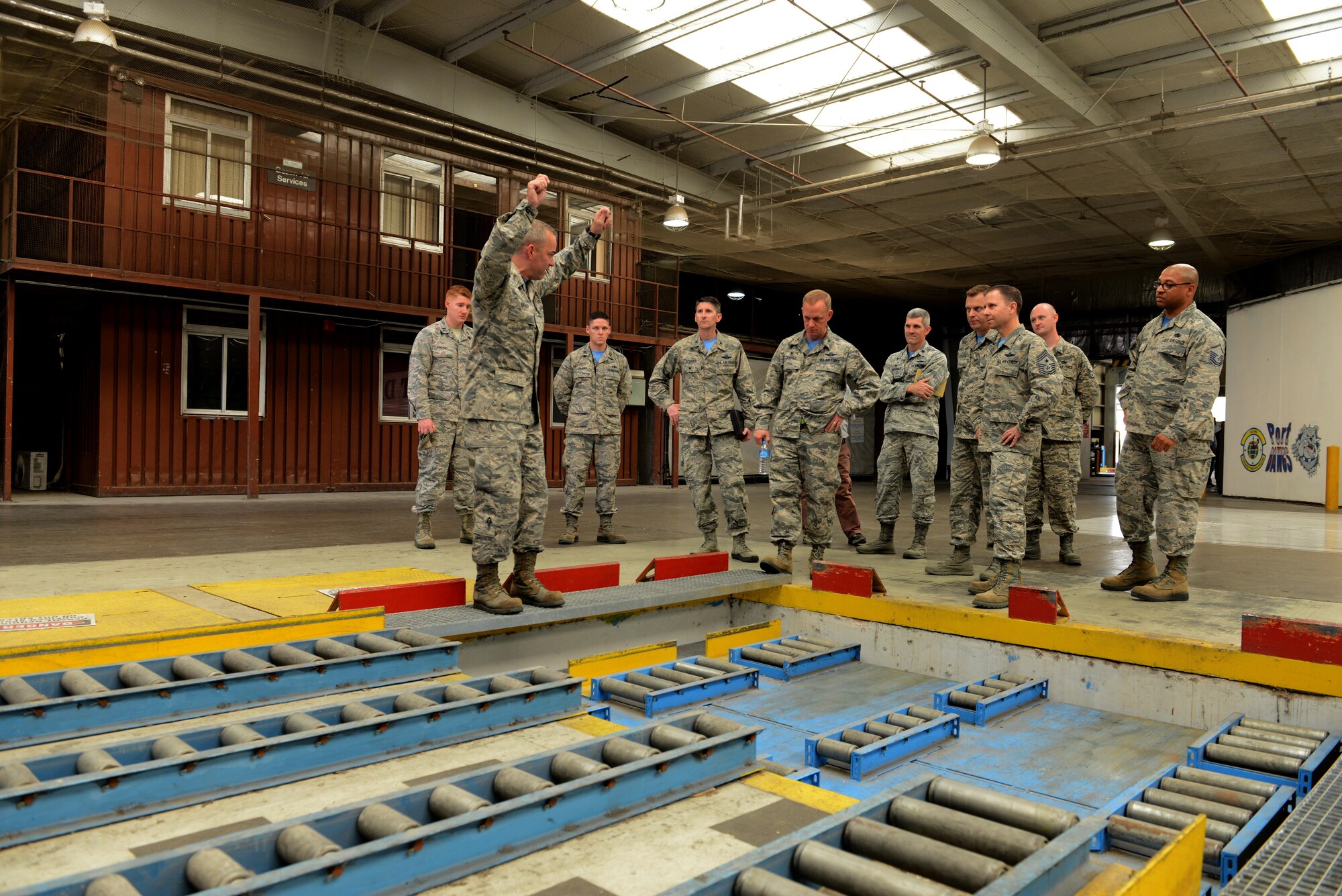 U.S. Air Force Tech. Sgt. Timothy Brady, 728th Air Mobility Squadron aircraft service section chief, demonstrates the palletizing process to U.S. Air Force Col. Thomas Cooper, 521st Air Mobility Operations Wing commander from Ramstein Air Force Base, Germany, Oct. 14, 2016, at Incirlik Air Base, Turkey. Cooper visited Incilik to better understand 728th AMS operations.
