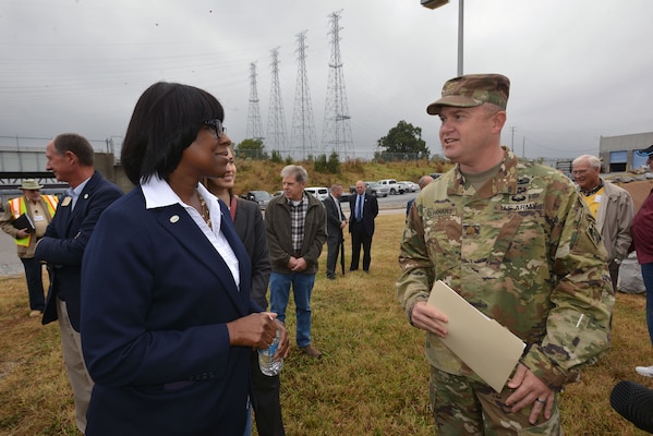 Maj. Christopher W. Burkhart, U.S. Army Corps of Engineer, Nashville District deputy district engineer, welcomes Kentucky Lt. Gov. Jenean Hampton to the Kentucky Lock Addition Project at Kentucky Lake Oct. 13, 2016.   
