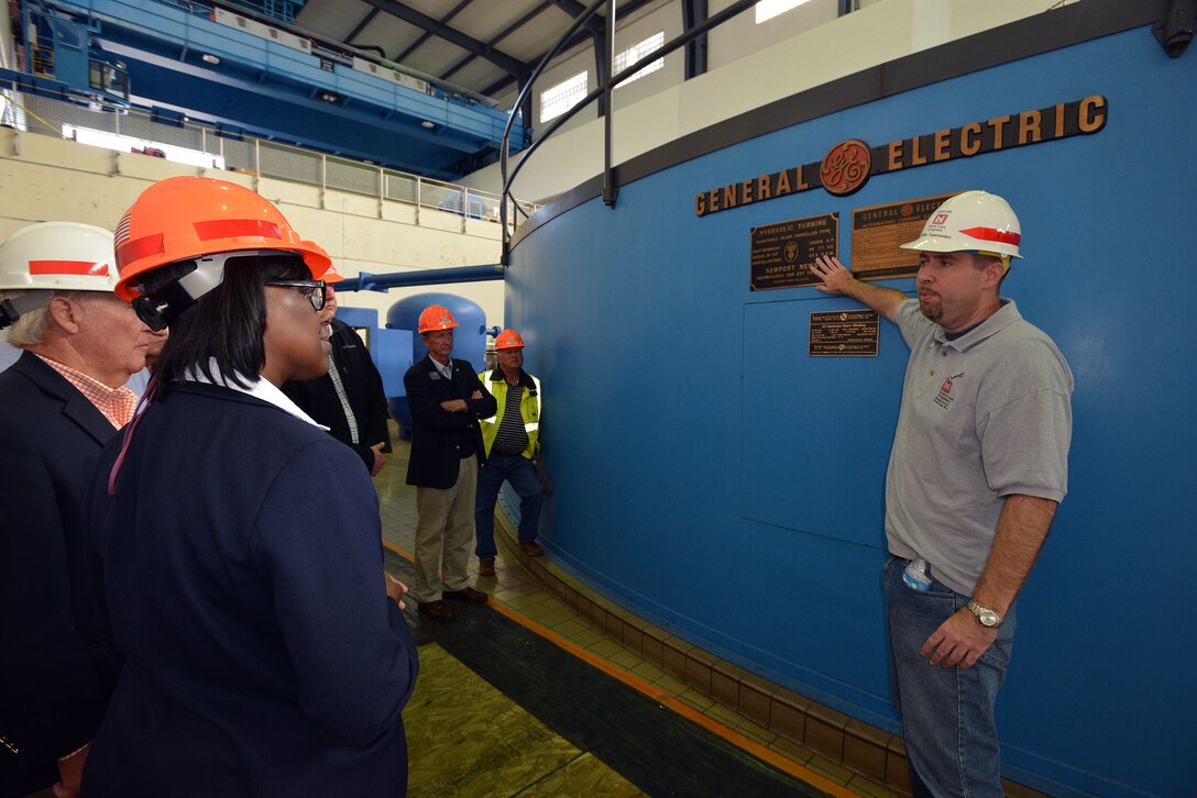 Jamie Holt, Barkley Power Plant superintendent, provides insight and overview of operations and led a tour of the structure and generators to Kentucky Lt. Gov. Jenean Hampton, and 12 board members from the Tennessee Tombigbee Waterway Development Authority toured the Kentucky Lock Addition Project and the Barkley Dam and Power plant on the Tennessee and Cumberland Rivers in Grand Rivers, Ky.