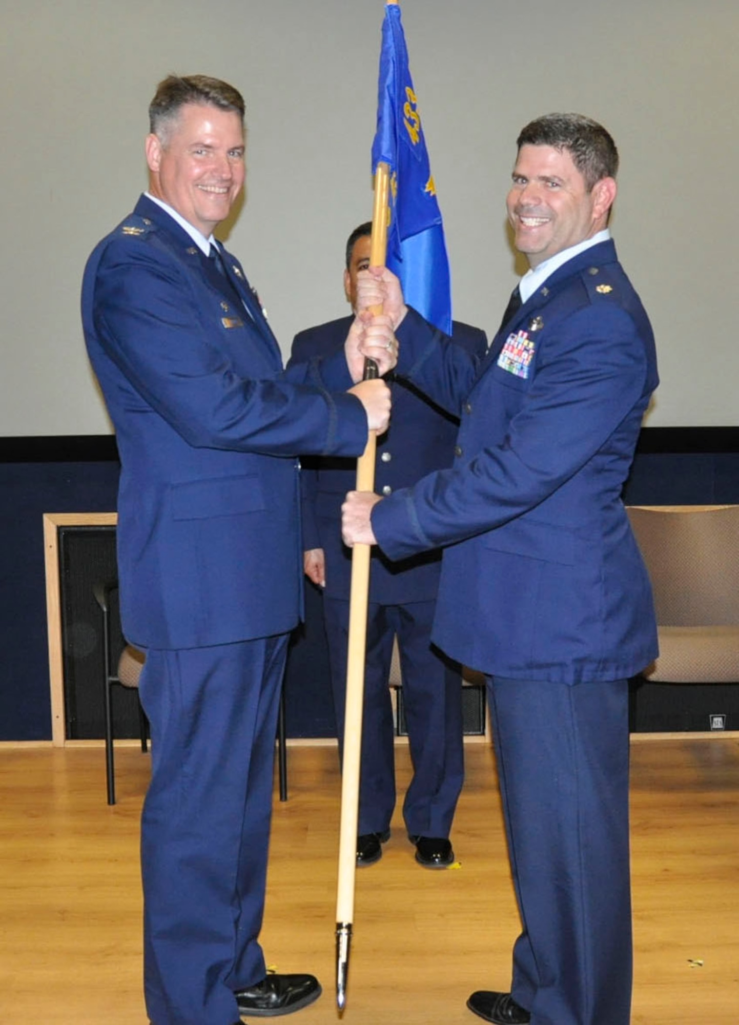 Col. Gregory P. Hayes, 433rd Operations Group commander (left), presents the 68th Airlift Squadron guidon to new commander, Lt. Col. Daniel King, during the 68th AS Change of Command Ceremony at Joint Base San Antonio-Lackland, Texas, Oct. 15, 2016. (U.S. Air Force photo by Senior Airman Bryan Swink) 