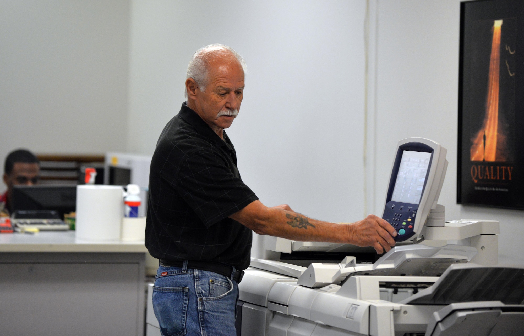 Joe Knott, an electronic duplicating systems technician with Defense Logistic Agencies Document Services, runs copies of a Xerox 4112 inside of the document services print shop located in the Martin Bomber Building on Oct. 6, Offutt Air Force Base, Neb.  The Offutt AFB Document Services is the only print shop qualified to perform duplication of classified, hard-copy documents.  