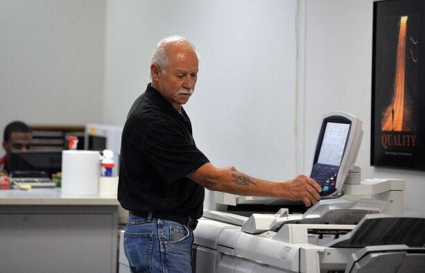 Joe Knott, an electronic duplicating systems technician with Defense Logistic Agencies Document Services, runs copies of a Xerox 4112 inside of the document services print shop located in the Martin Bomber Building on Oct. 6, Offutt Air Force Base, Neb.  The Offutt AFB Document Services is the only print shop qualified to perform duplication of classified, hard-copy documents.  