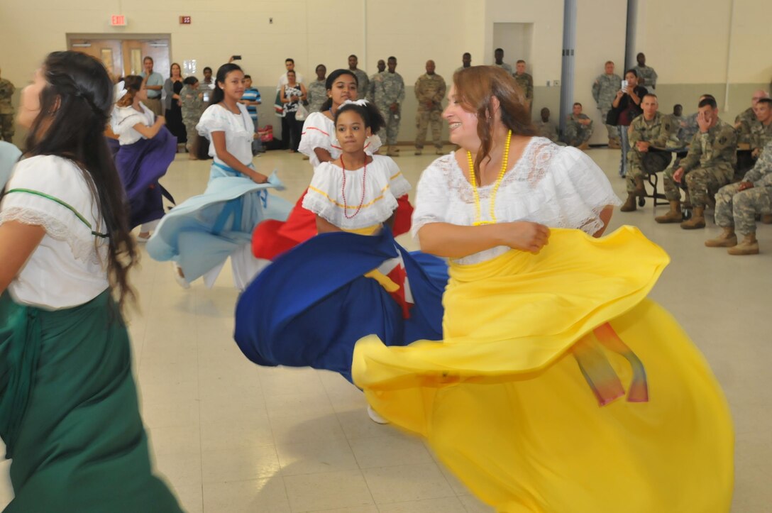 Mary Seda, leader of the Sion Dancers, performs for Army Reserve Soldiers assigned to the 359th Theater Tactical Signal Brigade, 335th Signal Command (Theater), Sept. 18 at Fort Gordon, Georgia, as part of a Hispanic Heritage month celebration and recognition. Seda, a military spouse, said the group has performed at area VA hospitals and military-sponsored activities, but this was the first time they had performed for Army Reserve Soldiers. (Official Army Reserve Photo by Sgt. Anthony J. Hooker, 359th TTSB public affairs)