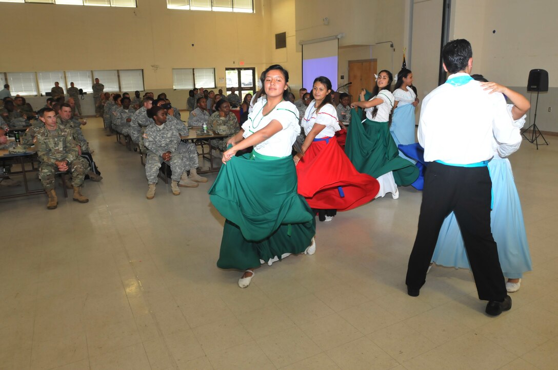 The Sion Dancers perform a traditional latin dance during a Hispanic Heritage month celebration for Army Reserve Soldiers of the  359th Theater Tactical Signal Brigade, 335th Signal Command (Theater) Sept. 18 at Fort Gordon, Georgia. The dance troup, comprised of students from nearby Columbia County, were among the highlights of the event. (Official U.S. Army Reserve photo by Sgt. Anthony J. Hooker, 359th TTSB public affairs)