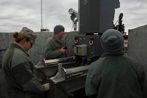 Airmen from the 5th Communications Squadron and combat arms instructors inspect Remote Target Engagement System towers in the weapons storage area at Minot Air Force Base, N.D., Oct. 12, 2016. Preventative maintenance inspections ensure the weapons system functions properly. (U.S. Air Force photo/Senior Airman Apryl Hall)