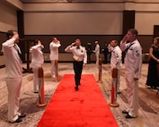 U.S. Navy Capt. Robert Hudson, Joint Base Charleston deputy commander, is piped aboard at the start of the Navy Ball at the Embassy Suites Hotel on Oct. 15. Hudson was the guest speaker for the evening.
