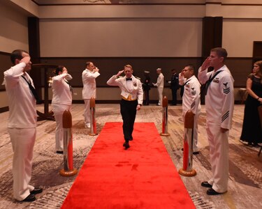 U.S. Navy Capt. Robert Hudson, Joint Base Charleston deputy commander, is piped aboard at the start of the Navy Ball at the Embassy Suites Hotel on Oct. 15. Hudson was the guest speaker for the evening.