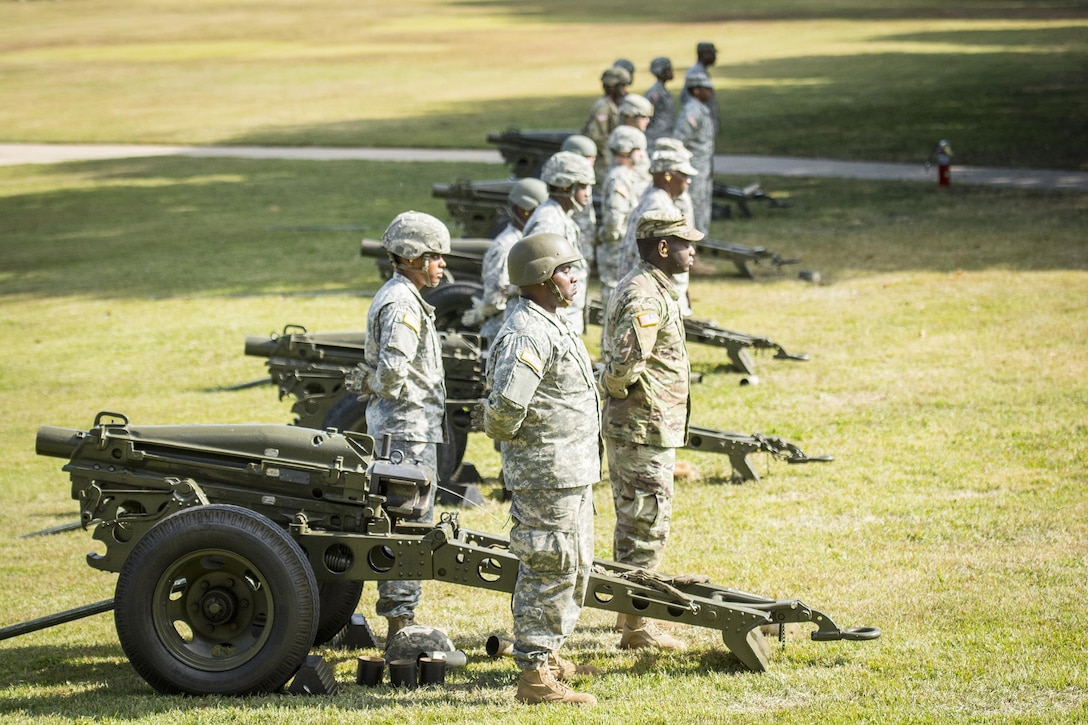 A cannon detail with the 335th Signal Command (Theater) stands at attention during a change of command ceremony at Fort McPherson, Ga., Oct. 15, 2016. (U.S. Army photo by Staff Sgt. Ken Scar)