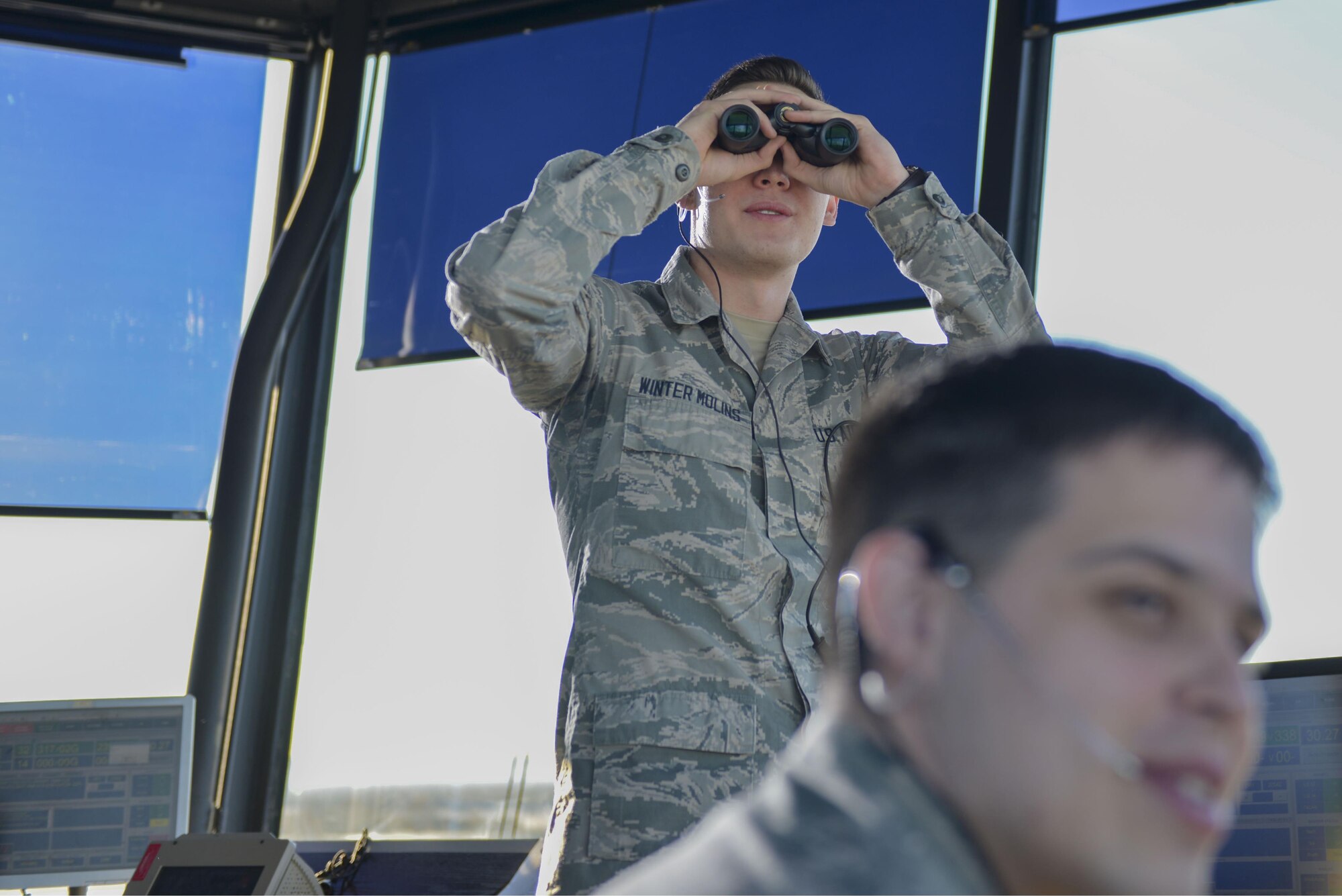 U.S. Air Force Airman 1st Class Kevin Winter Molins, a 354th Operations Support Squadron air traffic control apprentice, checks runway conditions Oct. 6, 2016, at Eielson Air Force Base, Alaska. Air traffic controllers manage aircraft in the air and on the ground. (U.S. Air Force photo by Airman Isaac Johnson)