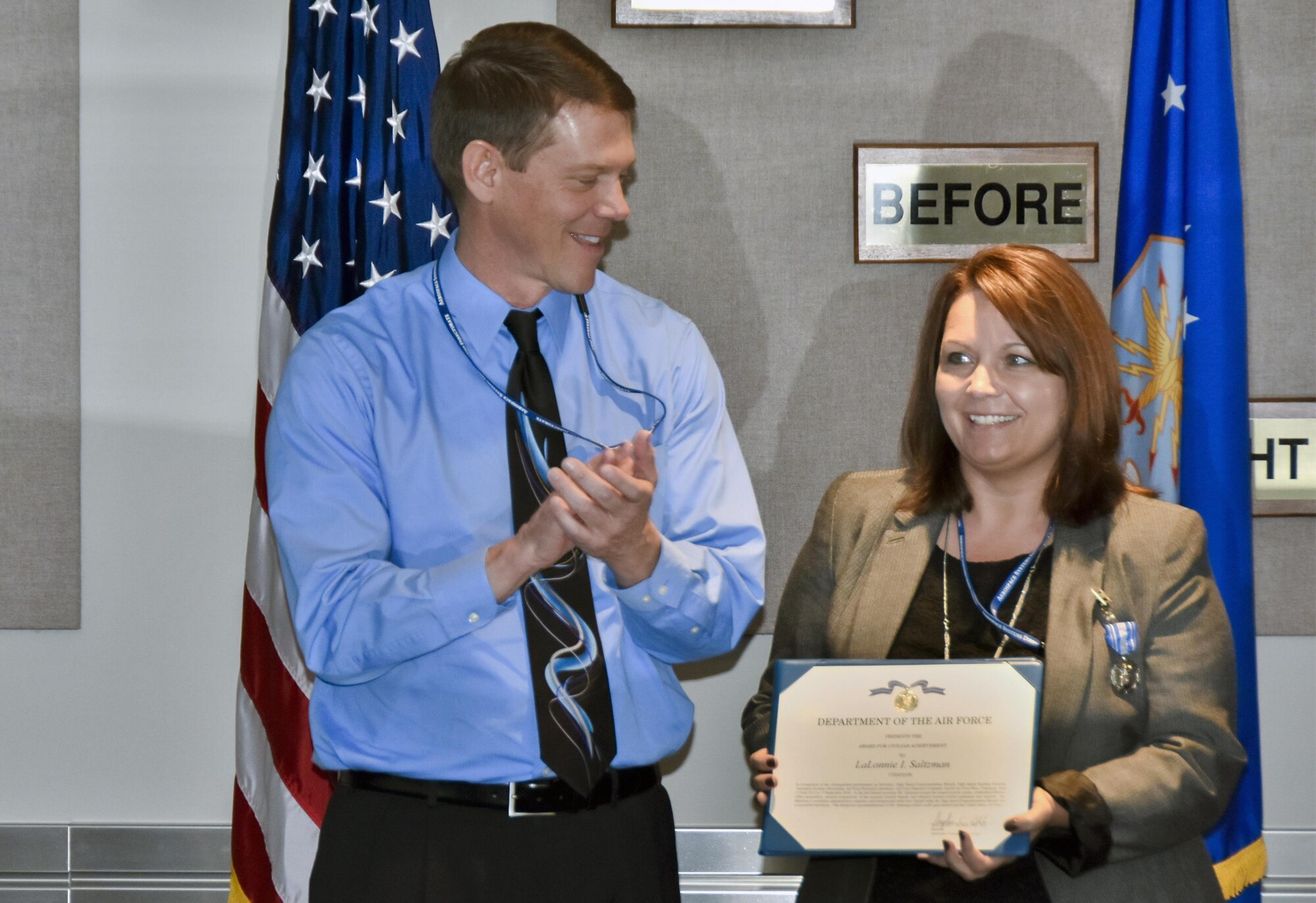 Lalonnie Saltzman (right), departing as the administrative assistant of the Air Force Research Laboratory High Speed Experimentation Branch for a new assignment in the Contracting Execution Division at AEDC, receives the Civilian Achievement Award, Sept. 30, honoring her time and accomplishments within the AFRL/RQHX branch. The award was presented by Dr. Douglas Blake, AFRL/RQ Director, visiting from Wright-Patterson Air Force Base. (U.S. Air Force photo/Jacqueline Cowan)
-AEDC-

