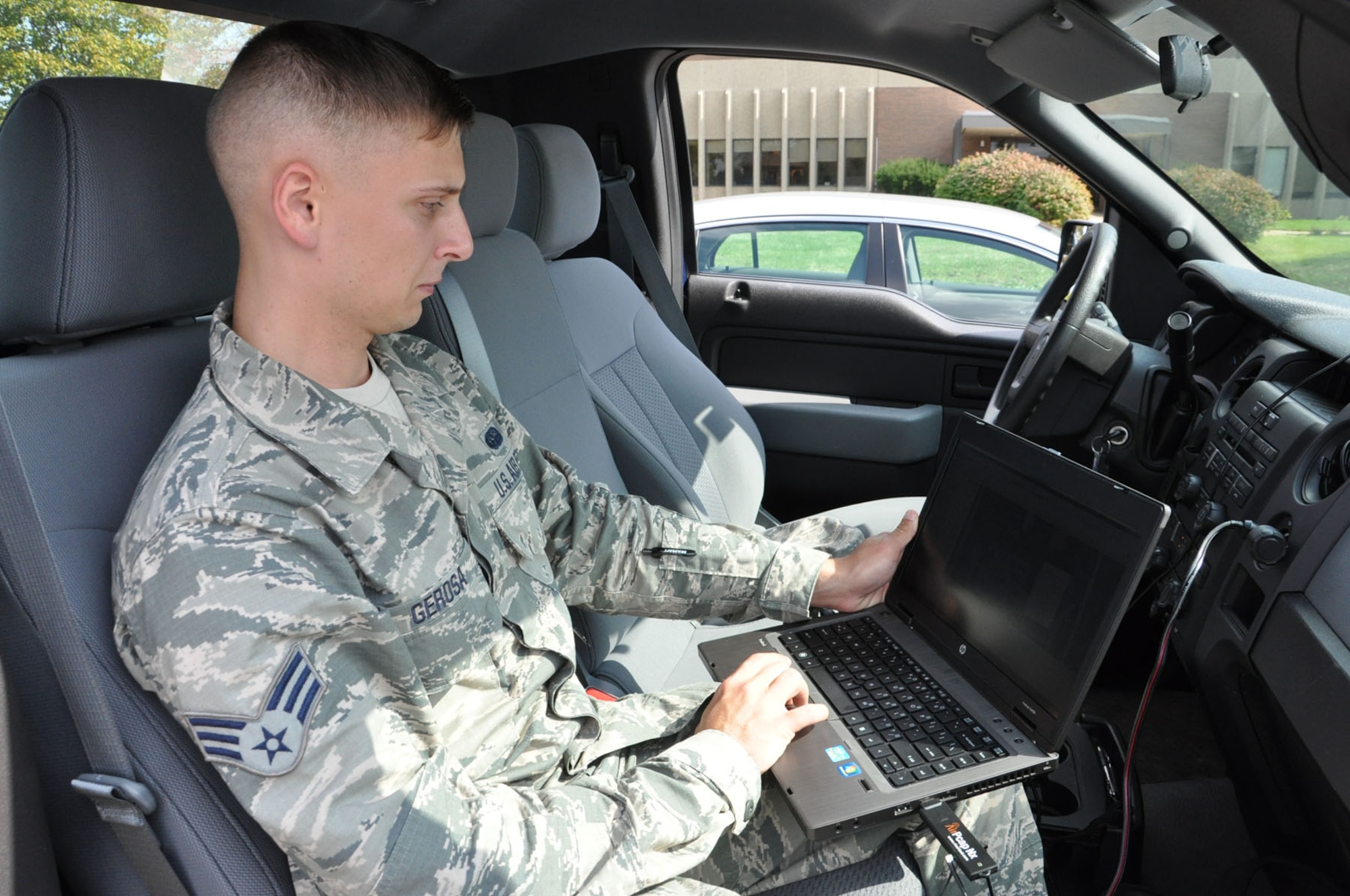 Senior Airman Lawrence Gerosa, a Cybersecurity Technician assigned to the 88th Air Base Wing Cybersecurity office for the past three years, demonstrates a software package provided by the Navy called “Flying Squirrel.” Teams from the wing cybersecurity office conduct  driving tours of both Areas A and B of Wright-Patterson AFB while conducting a procedure known as “War Driving,” where the software picks up packets of information that are transmitted by wireless devices in order to create a map of wireless devices located on base. The process helps eliminate false wireless connection points and ensures information is not transmitted in areas where it is prohibited, such as in secure facilities. 