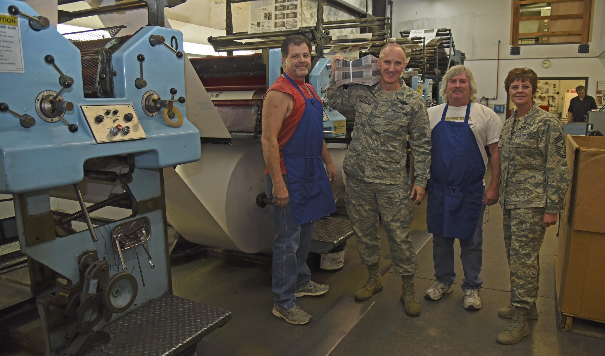 Cheney Free Press pressmen conclude the tour for Fairchild Leadership Oct. 13, 2016, at Cheney. The tour included the start to finish process of producing the Fairchild Flyer. Each newspaper is created using locally sourced newsprint, weighing in at nearly 800 pounds when on the roll. (U.S. Air Force photo/Senior Airman Mackenzie Richardson)