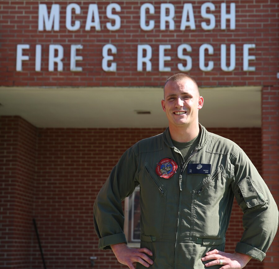 Cpl. Ryan Sargent poses in front of his unit building aboard Marine Corps Air Station Cherry Point, N.C., July 18, 2016. Sargent is a firefighter with Aircraft, Rescue and Firefighting aboard MCAS Cherry Point. 