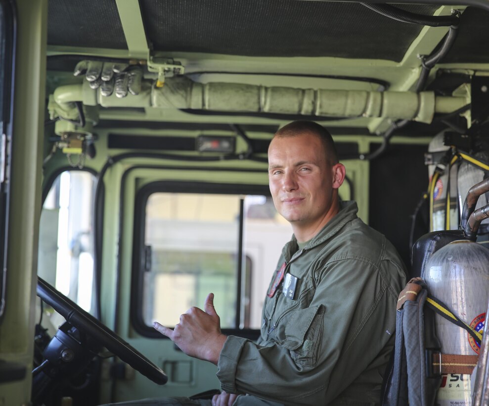 Cpl. Ryan Sargent sits in a fire and crash truck aboard Marine Corps Air Station Cherry Point, N.C., July 18, 2016. Sargent is a firefighter with Aircraft, Rescue and Firefighting aboard MCAS Cherry Point. 