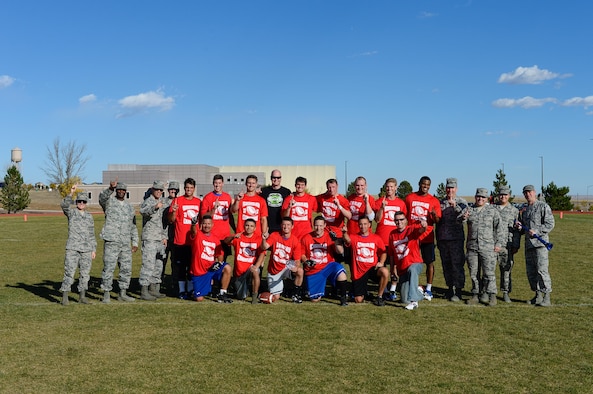 Members of the 1st Space Operations Squadron celebrate following their 35-18 win over the 3rd Space Operations Squadron in the intramural flag football championship game at Schriever Air Force Base, Colorado, Thursday, Oct. 13, 2016. 1 SOPS capped an undefeated season and got redemption for a loss in the 2014 championship game with the win. (U.S. Air Force photo/Christopher DeWitt)