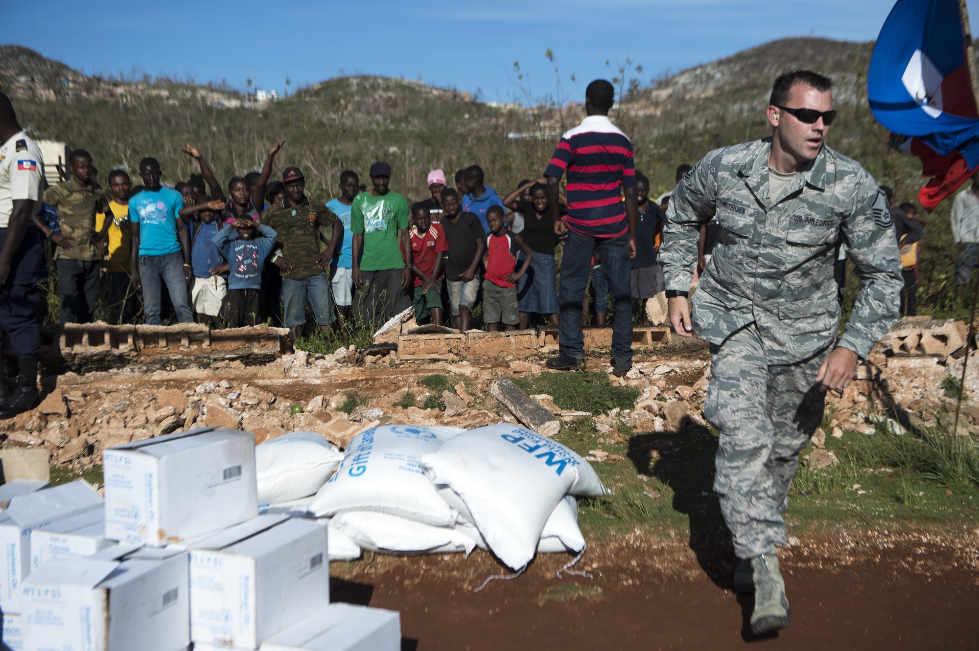 Master Sgt. Gabriel Peterson, of the 290th Joint Communications Support Element, delivers cooking supplies to citizens of Beaumont, Haiti, Oct. 13, 2016. Peterson is part of Joint Task Force Matthew, which has delivered more than 440 tons of supplies to Haitian citizens affected by Hurricane Matthew. (U.S. Air Force photo/Tech. Sgt. Russ Scalf)