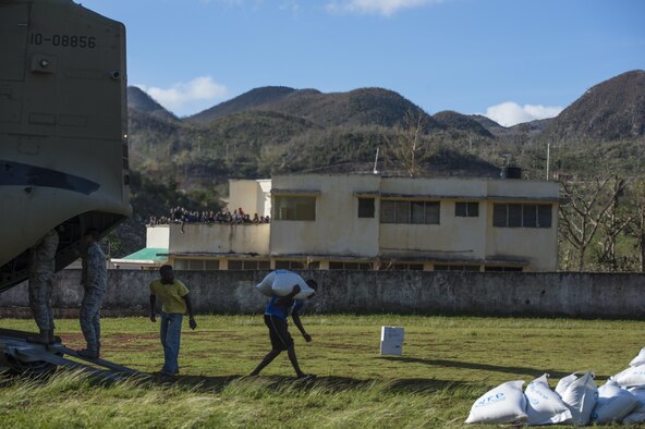U.S. service members and citizens of Beaumont, Haiti, unload supplies from a CH-47 Chinook Oct. 13, 2016. Service members supporting Joint Task Force Matthew have delivered more than 440 tons of supplies to Haitians affected by Hurricane Matthew. (U.S. Air Force photo/Tech. Sgt. Russ Scalf)