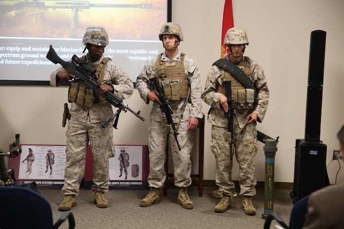 Marines model the individual combat load for various Marine MOSs during Industry Day of the Infantry Equipping Challenge aboard Marine Corps Base Quantico on September 26, 2016.