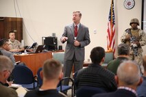 Mr. David Karcher, who spearheads the IEC at MCSC, briefs Industry during the Infantry Equipping Challenge aboard Marine Corps Systems Command's Gruntworks facility on September 26, 2016.