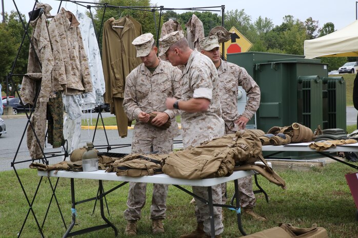 MCSC commander BGen Joseph Shrader examines the individual protective equipment used by Marines during the Infantry Equipping Challenge's Industry Day on September 26, 2016.