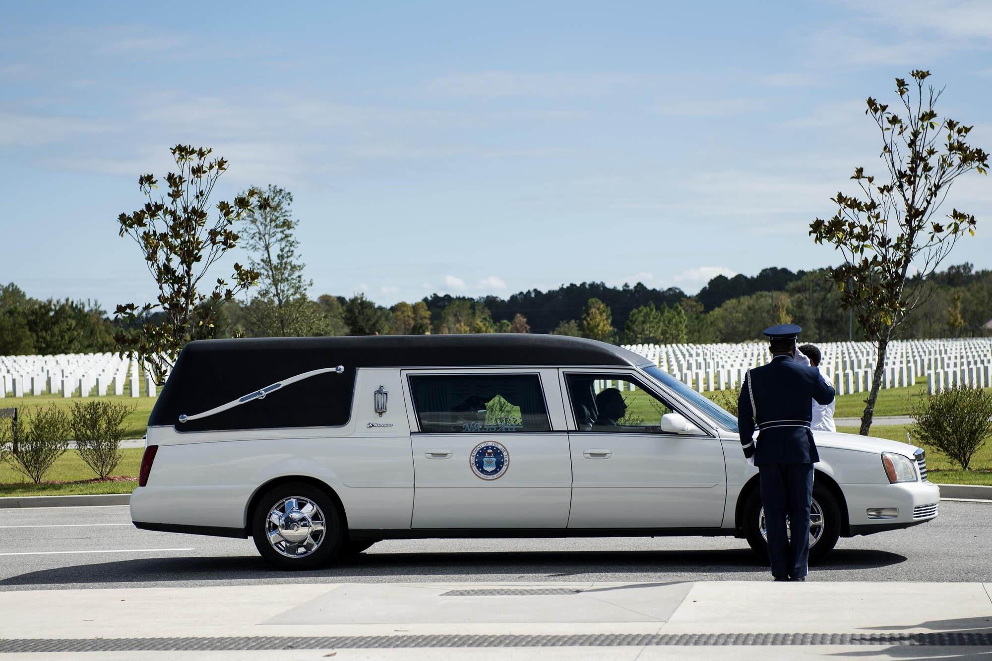 A member of the Moody Air Force Base Honor Guard salutes a hearse during a funeral, Oct. 13, 2016, in Jacksonville, Fla. For this particular funeral, Moody’s honor guard took 21 members, splitting them into various details to perform military honors for a fallen active-duty member. (U.S. Air Force photo by Airman 1st Class Janiqua P. Robinson)