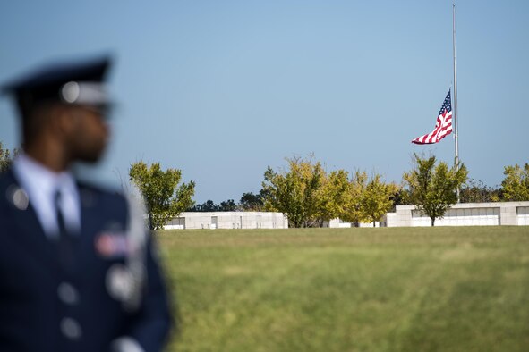A member of the Moody Air Force Base Honor Guard looks at the United States flag at half-mast before a funeral, Oct. 13, 2016, in Jacksonville, Fla. Moody’s honor guard, also known as the Knights of Honor, are comprised of up to 25 active duty Airmen. (U.S. Air Force photo by Airman 1st Class Janiqua P. Robinson)