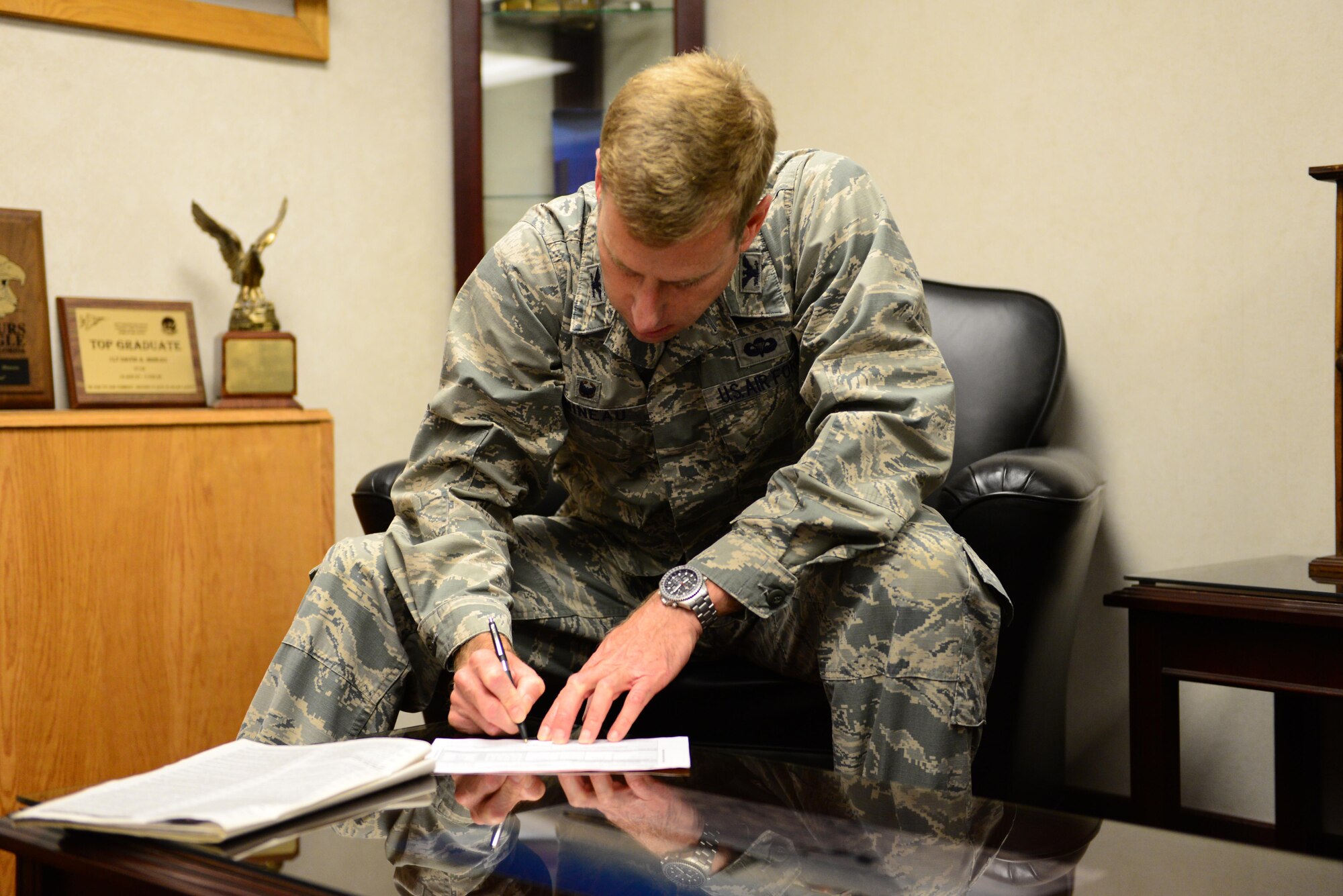 U.S. Air Force Col. David Mineau, the 354th Fighter Wing commander, signed a Combined Federal Campaign (CFC) donation Oct. 11, 2016, at Eielson Air Force Base, Alaska. The CFC allows Airmen to contribute to more than 20,000 charities around the world. (U.S. Air Force photo by Airman 1st Class Cassandra Whitman)