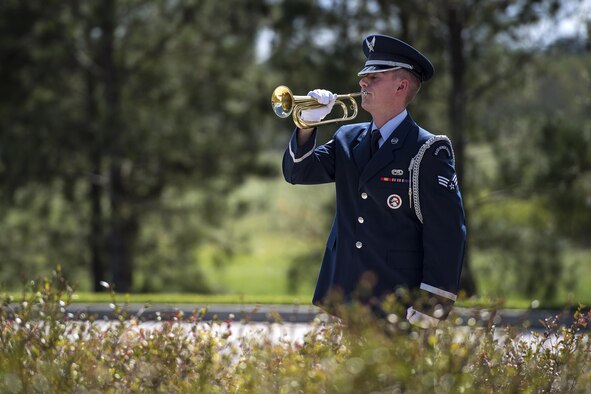 A member of the Moody Air Force Base Honor Guard plays ‘Taps’ on a bugle horn during a funeral, Oct. 13, 2016, in Jacksonville, Fla. ‘Taps’ was composed in 1862 and is a played at dusk, during flag ceremonies and at military funerals. (U.S. Air Force photo by Airman 1st Class Janiqua P. Robinson)