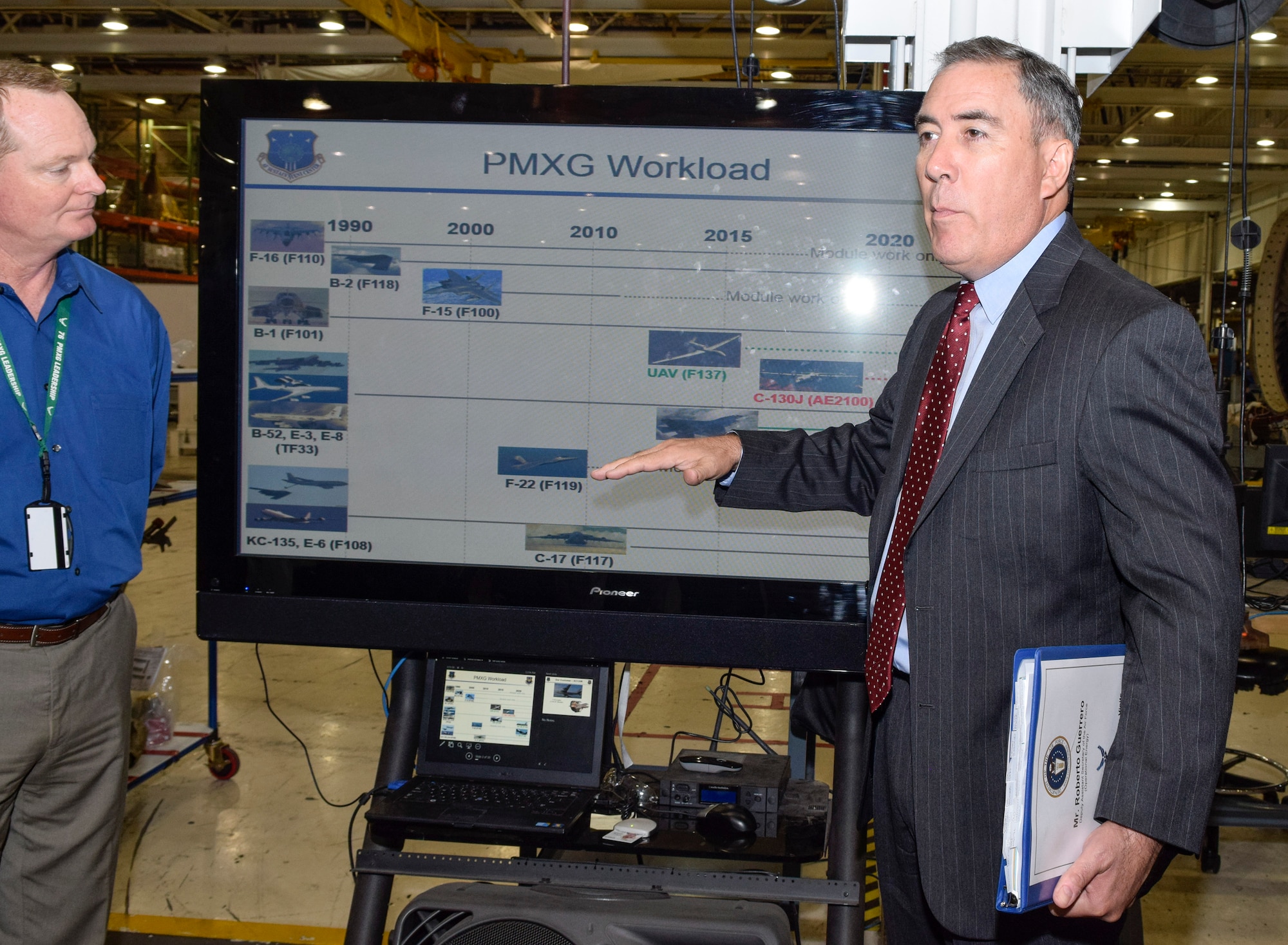 Mr. Roberto Guerrero, Deputy Assistant Secretary of the Air Force for Operational Energy, Office of the Assistant Secretary of the Air Force for Installations, Environment and Energy, right, talks about how his office is working to lower costs associated with energy and fuel for Air Force aircraft during a visit to  building 9001 Sept. 13, 2016, Tinker Air Force Base, Okla. Guerrero toured parts of the Oklahoma City Air Logistics Complex to learn about energy saving initiatives and programs here and share ideas for the future. U.S. Air Force photo/Greg L. Davis)