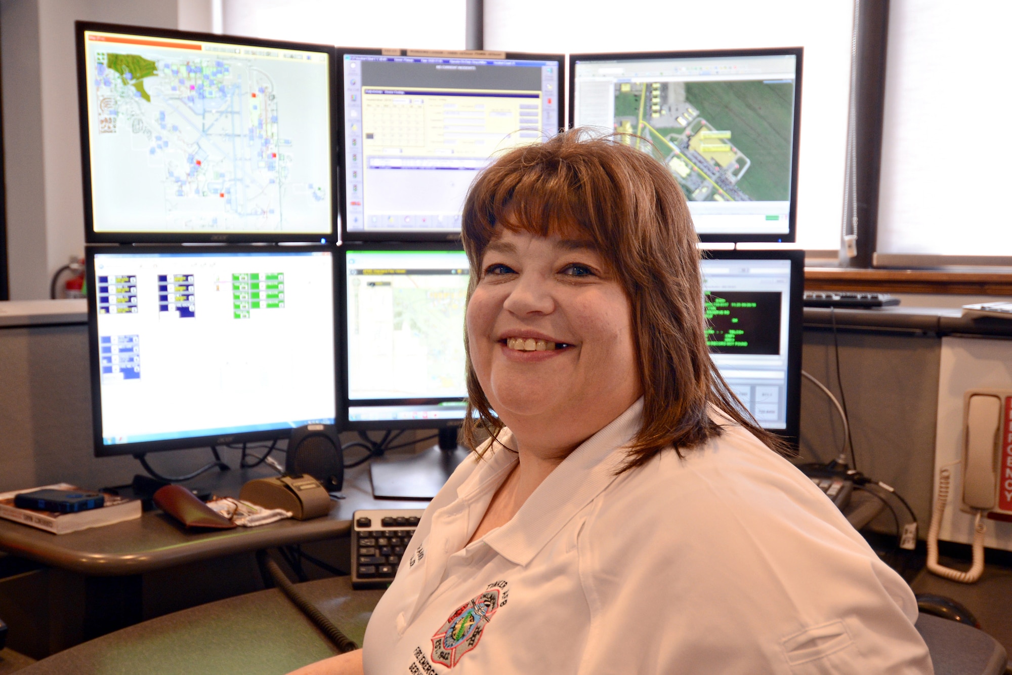 Lori Shannon recently received a six-month clear scan of her Stage 2 breast cancer that she battled the past year. Ms. Shannon is a 911 dispatcher in the Tinker Emergency Dispatch Center with the 72nd Air Base Wing Civil Engineering Directorate. (Air Force photo by Kelly White)