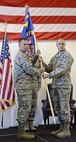 Lt. Col. Keith Quick, right, assumed command of the 72nd Security Forces Squadron during a ceremony Oct. 5. Col. Michael Green, left, commander of the 72nd Mission Support Group, presided over the ceremony and Senior Master Sgt. Justin King served as the guidon bearer. (Air Force photo by Kelly White)