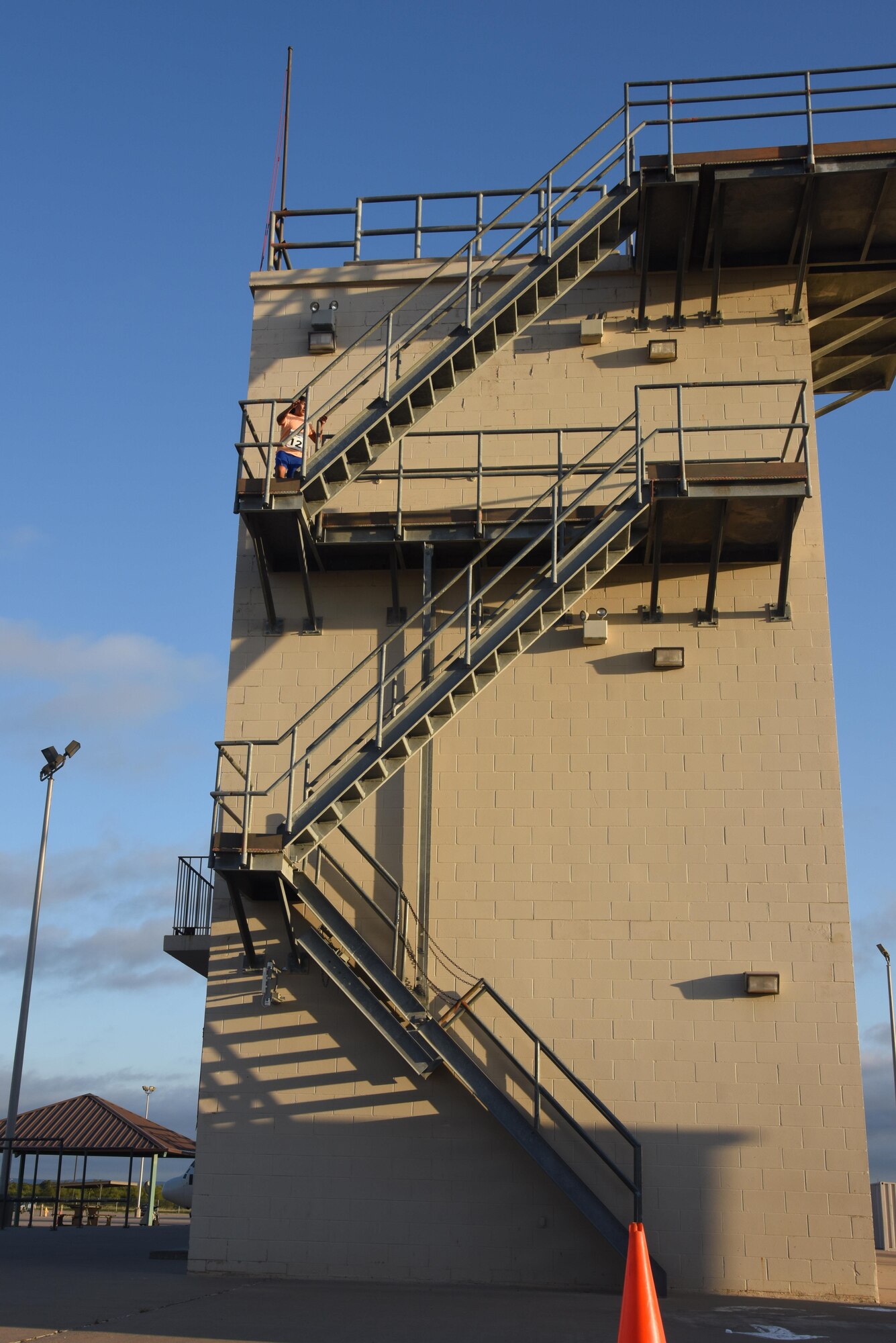 U.S. Army Sgt. Juana Santos, 344th Military Intelligence Battalion supply sergeant, scales a set of stairs at the Louis F. Garland Department of Defense Fire Academy on Goodfellow Air Force Base, Texas, during the 3rd Annual Blood, Sweat and Stairs competition, Oct. 15, 2016. During the competition, contestants had to climb the stairs of several training buildings on the fire training pad. The competition is held each year to honor the first responders of 9/11, however the 312th TRS rescheduled it this year due to bad weather. (U.S. Air Force photo by Senior Airman Joshua Edwards/Released)