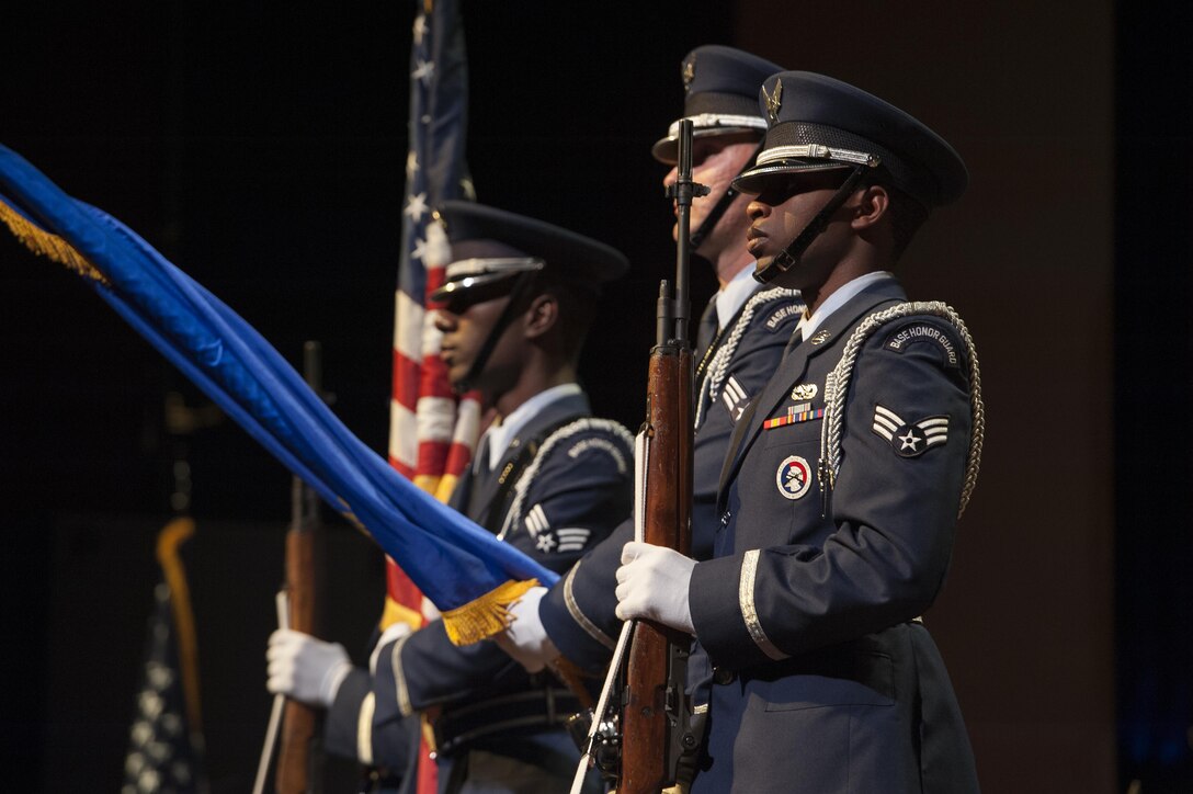 Members of the 633rd Air Base Wing Honor Guard post the colors during a U.S. Air Force Heritage of America Band Concert at the Ferguson Center for the Arts in Newport News, Va., Oct. 1, 2016. The 633rd ABW Honor Guard participates in more then 300 events a year including military funeral honors, military ceremonies, and community functions. (U.S. Air Force photo by Staff Sgt. Nick Wilson)