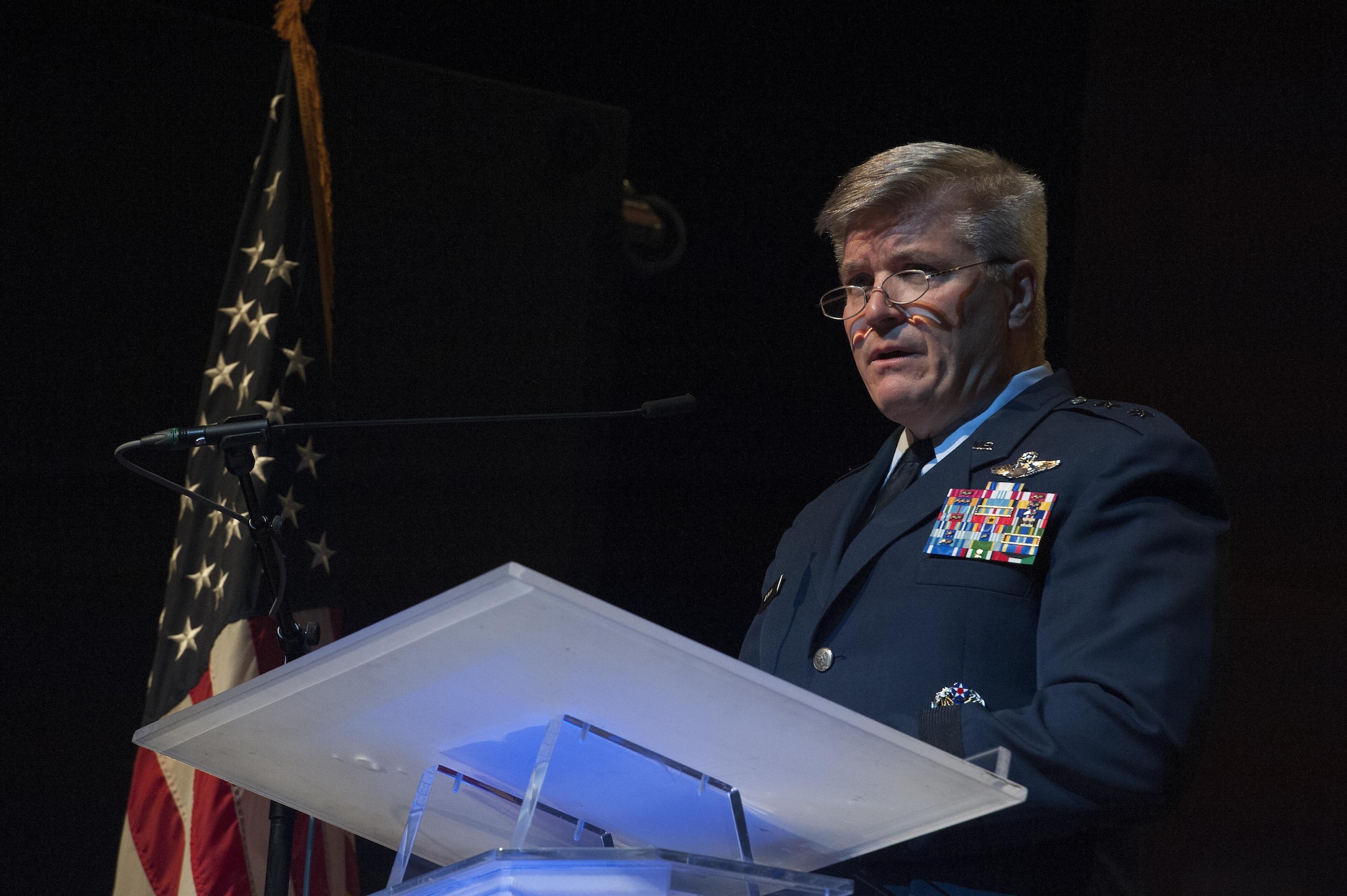 Maj. Gen. Jerry Harris, vice commander, Air Combat Command, Joint Base Langley-Eustis, Va., speaks during a U.S. Air Force Heritage of America Band 75th Anniversary Band Concert at the Ferguson Center for the Arts in Newport News, Va., Oct. 1, 2016. The USAF HOAB was one of the original Army Air Corps bands, created by order of the Secretary of War on October 1, 1941 and assigned to Barksdale Field, Louisiana. In June 1946, after being assigned to Brooks Field, Texas, the band arrived at Joint Base Langley-Eustis, Virginia, its current home. (U.S. Air Force photo by Staff Sgt. Nick Wilson) 