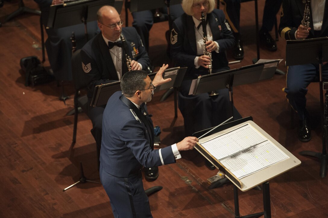 Capt. Rafael Toro-Quinones, commander and conductor of the United States Air Force Band of the Golden West, Travis Air Force Base, Calif., directs the U.S. Air Force Heritage of America Band to play “There’s No Business Like Show Business” during a USAF HOAB 75th Anniversary Band Concert at the Ferguson Center for the Arts in Newport News, Va., Oct. 1, 2016. Toro-Quinones was the former USAF HOAB conductor from 2009 to 20011. (U.S. Air Force photo by Staff Sgt. Nick Wilson) 