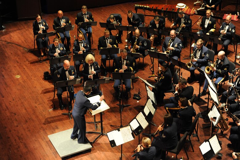 Capt. Rafael Toro-Quinones, commander and conductor of the United States Air Force Band of the Golden West, Travis Air Force Base, Calif., directs the U.S. Air Force Heritage of America Band to play “There’s No Business Like Show Business” during a USAF HOAB 75th Anniversary Band Concert at the Ferguson Center for the Arts in Newport News, Va., Oct. 1, 2016. Toro-Quinones was the former USAF HOAB conductor from 2009 to 20011. The USAF HOAB was one of the original Army Air Corps bands, created by order of the Secretary of War on October 1, 1941 and assigned to Barksdale Field, Louisiana. In June 1946, after being assigned to Brooks Field, Texas, the band arrived at Joint Base Langley-Eustis, Virginia, its current home. (U.S. Air Force photo by Staff Sgt. Nick Wilson) 
