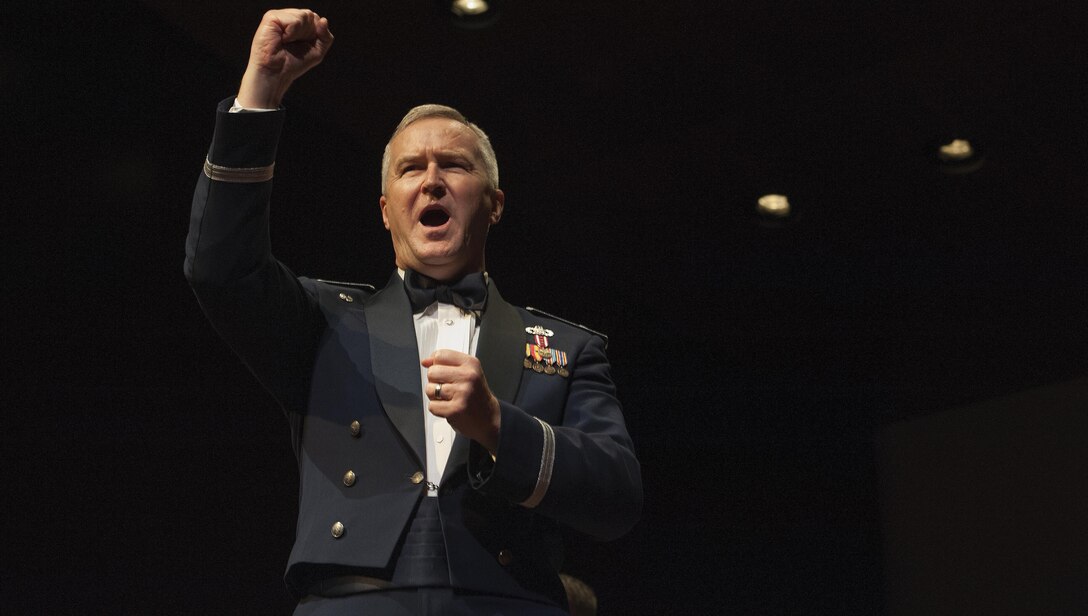 Col. (Ret.) Larry H. Lang, former U.S. Air Force Heritage of America Band director, shouts out, “Give her the Gun!” during the playing of the Air Force Song during a USAF HOAB 75th Anniversary Band Concert at the Ferguson Center for the Arts in Newport News, Va., Oct. 1, 2016. In 2005, Lang was inducted into the prestigious American Bandmasters Association. He is also a member of numerous musical associations and is active as a guest conductor and clinician throughout the United States and abroad. (U.S. Air Force photo by Staff Sgt. Nick Wilson)