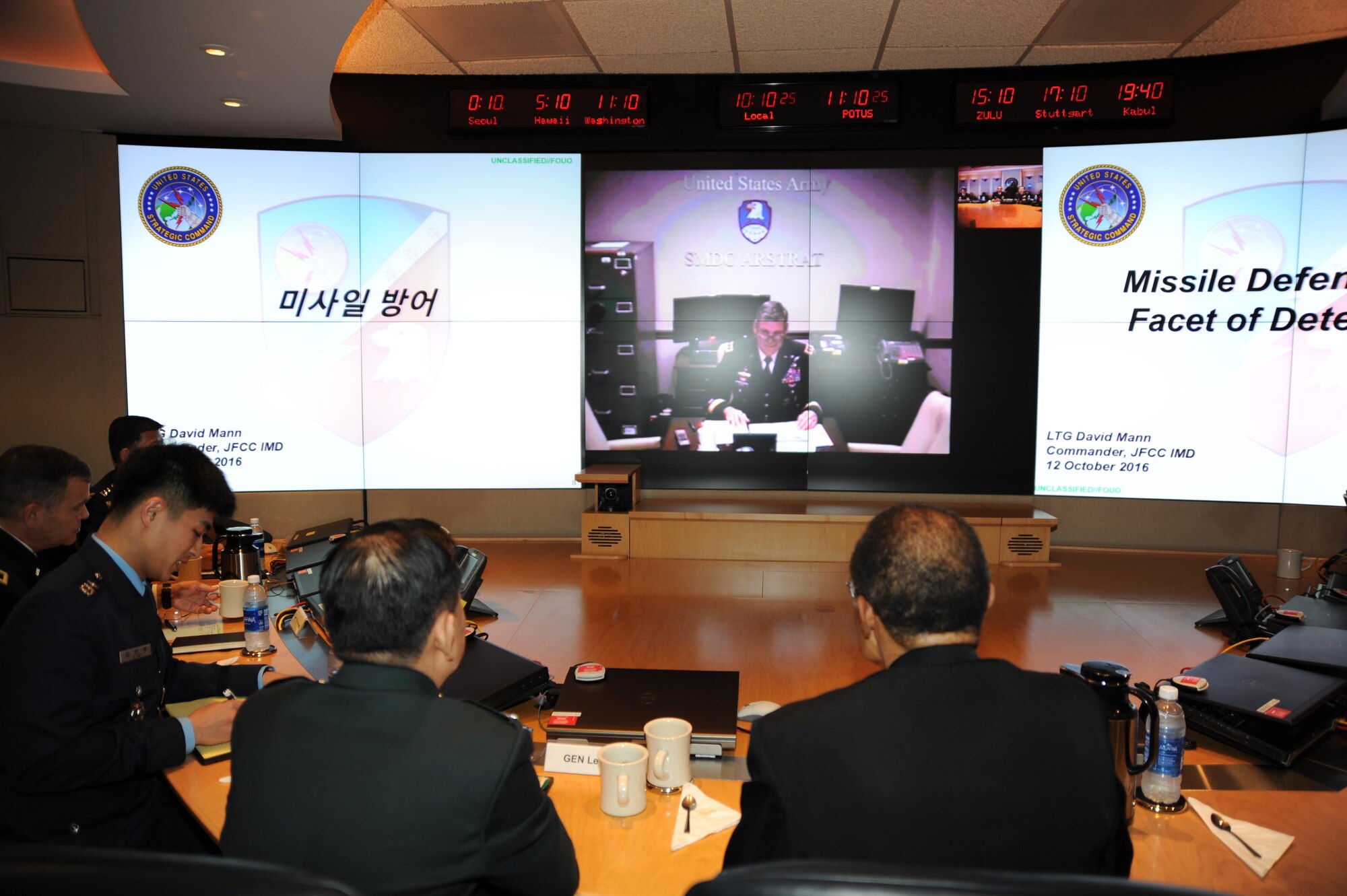 PETERSON AIR FORCE BASE, Colo. - Lt. Gen. David L. Mann, commanding general of U.S. Army Space and Missile Defense Command/Army Forces Strategic Command and Joint Functional Component Command for Integrated Missile Defense (on screen), briefs Republic of Korea Army Gen. Lee Sun-Jin, and other USSTRATCOM senior leaders about missile defense via video teleconference at Peterson Air Force Base, Colorado, Oct. 12, 2016. Lee visited USSTRATCOM as part of a Chairman's Counterpart Visit, and received a command orientation on USSTRATCOM's roles and missions, which include an overall United States extended deterrence commitment to the Republic of Korea. (U.S. Strategic Command photo)