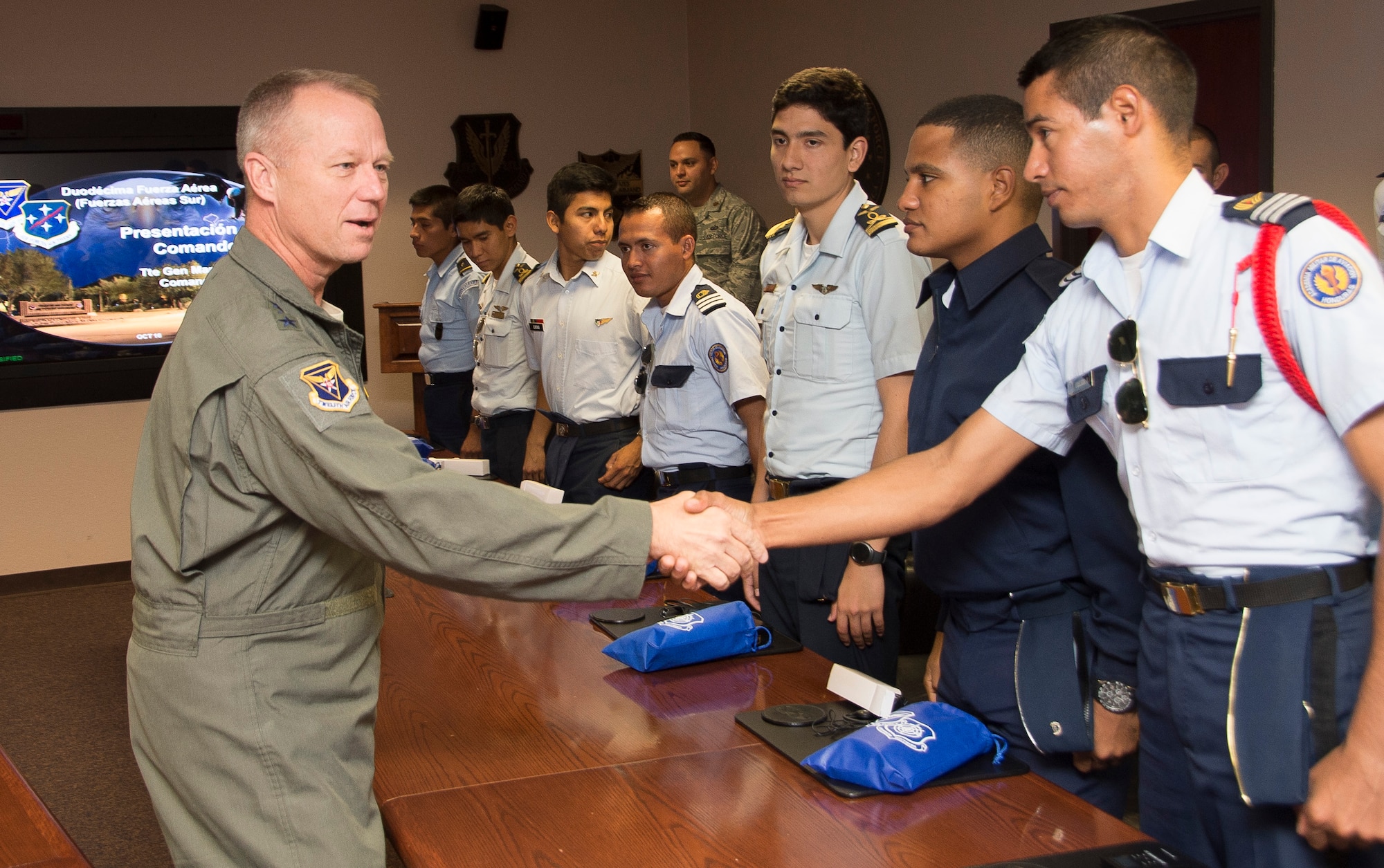 U.S. Air Force Lt. Gen. Mark Kelly, 12th Air Force (Air Forces Southern) commander, greets cadets from various academies throughout Latin America before a mission brief at Davis-Monthan Air Force Base, Ariz., Oct. 13, 2016. The cadets are visiting Davis-Monthan AFB as part of the Latin American Cadet Initiative, which allows the top two senior cadets from up to 15 Latin American air force academies to visit the U.S. for three weeks to familiarize them with the U.S. Air Force. (U.S. Air Force photo by Staff Sgt. Adam Grant)