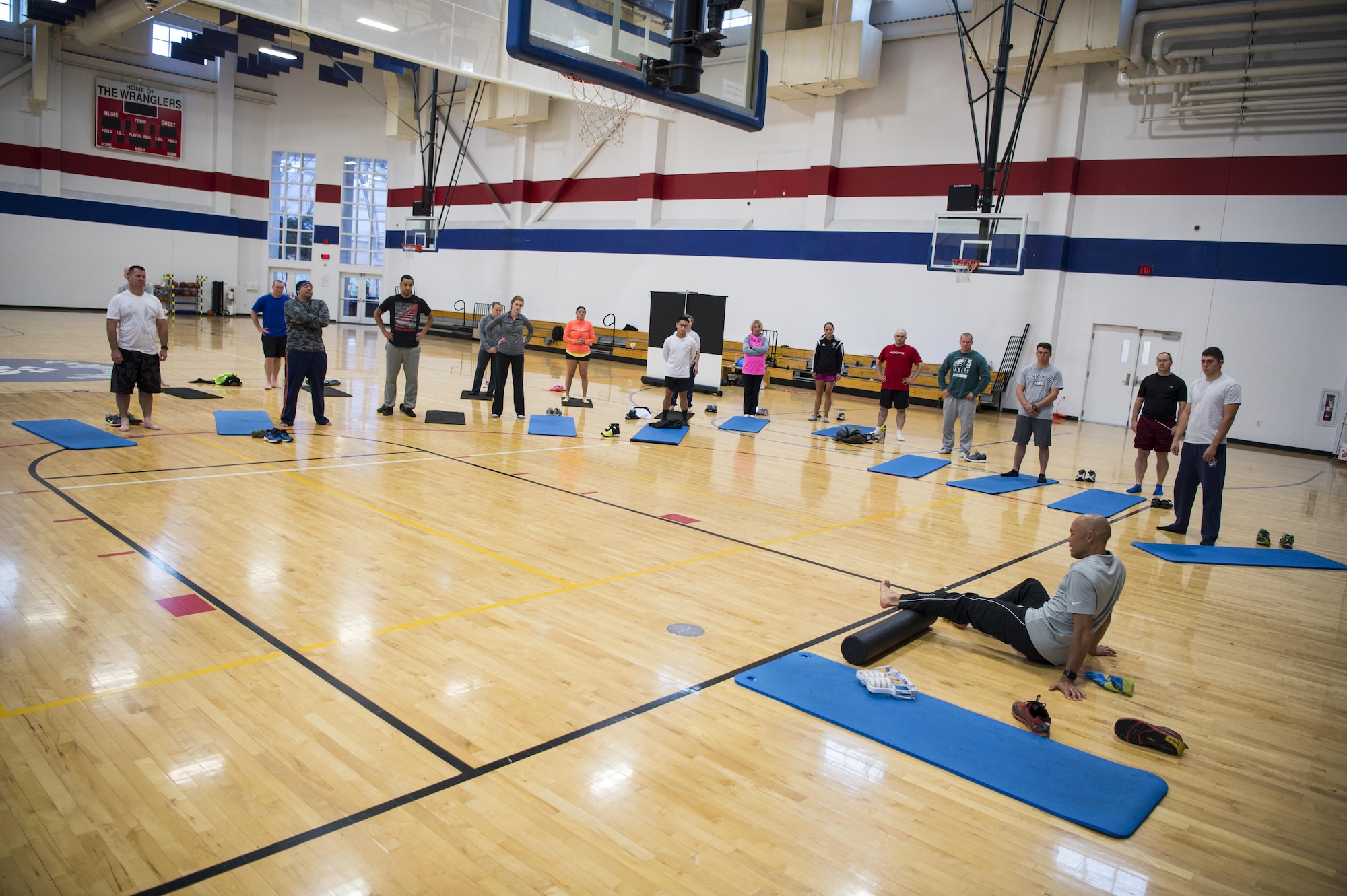 Ian Adamson, president of Healthy Running, uses a foam roller to demonstrate ankle and calf stretching during a natural running form clinic at F.E. Warren Air Force Base, Wyo., Oct. 6, 2016. Adamson has a master’s degree in sports medicine and uses his experience and knowledge to teach about healthy living and how to improve running. “I think courses like this bring a different perspective on fitness compared to what Airmen continue to hear from base health services,” said Alison Morrell, 90th Medical Operations Squadron health promotion coordinator. “Adamson is a professional who has won multiple gold medals and broken world records. He shows that he knows what he is talking about through his education and experience.” (U.S. Air Force photo by Staff Sgt. Christopher Ruano)