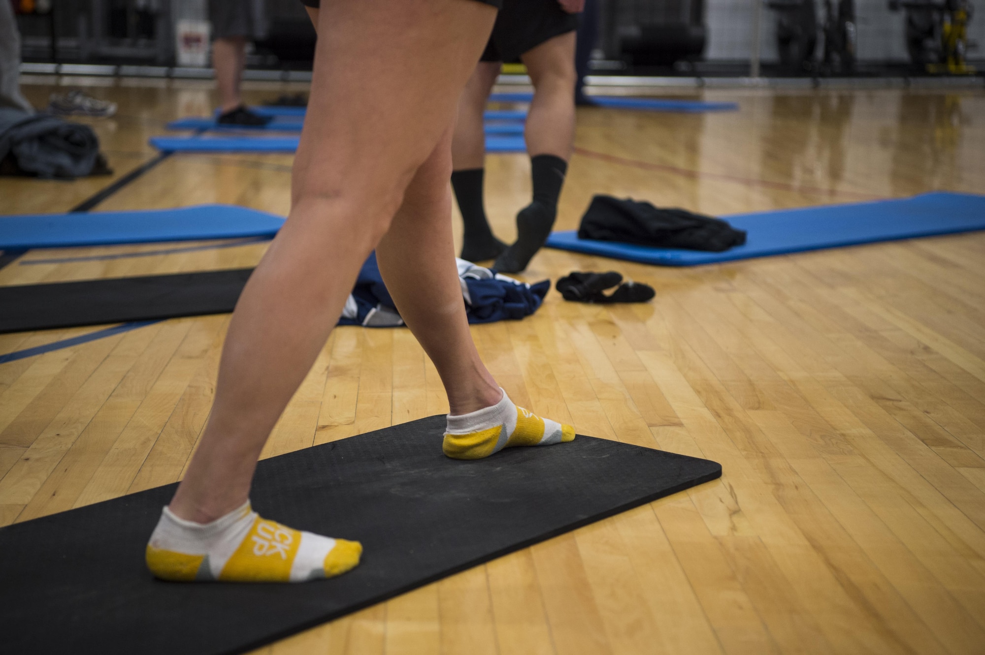 Staff Sgt. Vanessa Harsh, 90th Missile Wing occupational safety technician, performs a calf stretch during a natural running form clinic at F.E. Warren Air Force Base, Wyo., Oct. 6, 2016. Students learned multiple stretches to familiarize the different areas of muscles used when running. “We are teaching this class to show Airmen how to run more efficiently and reduce the risk of injury,” said Ian Adamson, president of Healthy Running. “We everyone to be fit and functional for their duties, while keeping them happier and healthier at home.” (U.S. Air Force photo by Staff Sgt. Christopher Ruano)