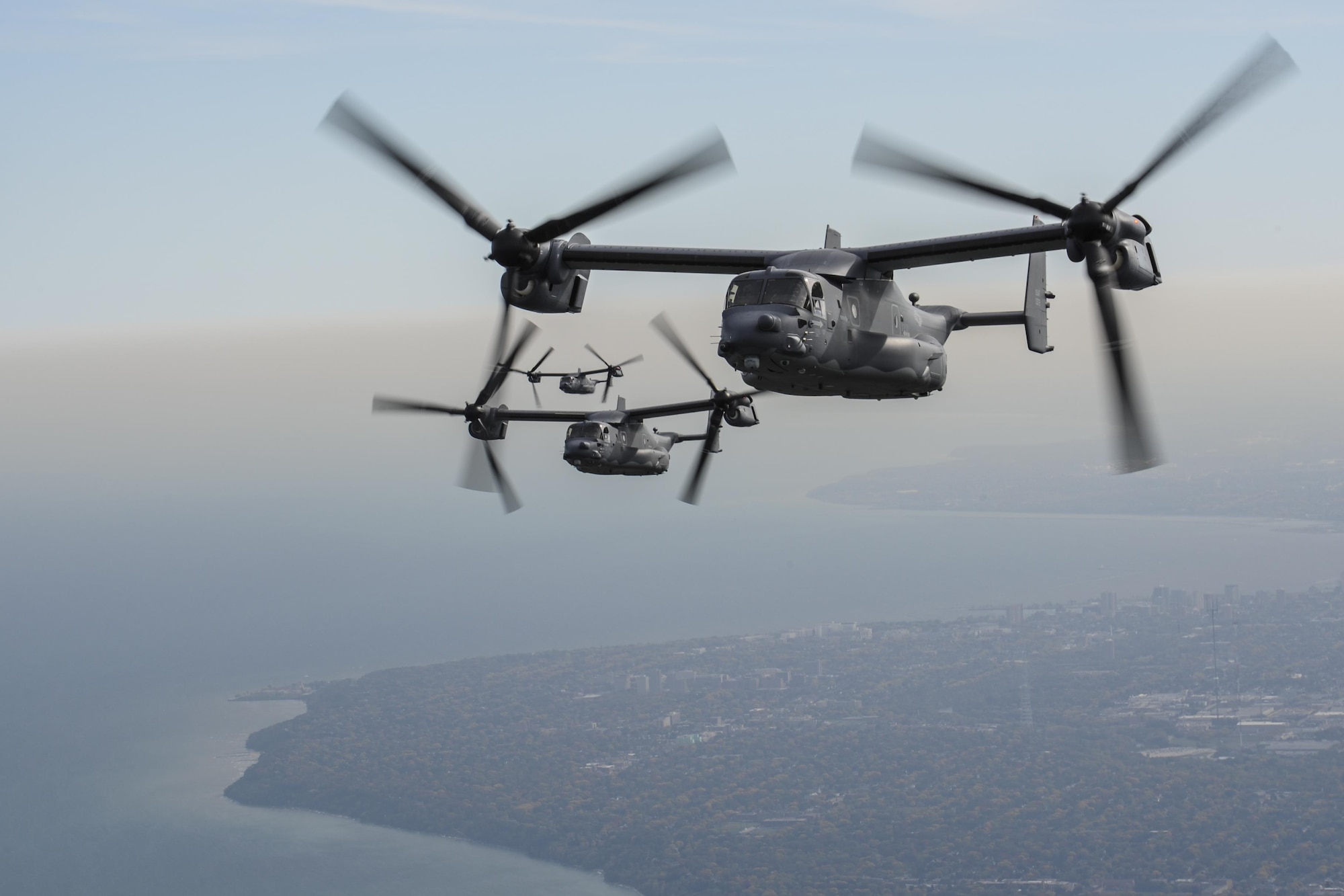 Four CV-22 Osprey aircraft with the 8th Special Operations Squadron from Hurlburt Field, Fla., fly along the Lake Michigan coast, Oct. 14, 2016. The 8th SOS visited the Milwaukee-Green Bay area for a flyover above Lambeau Field Oct. 16 during the Green Bay versus Dallas NFL game. The Osprey is a tiltrotor aircraft that combines the vertical takeoff, hover and vertical landing qualities of a helicopter with the long-range, fuel efficiency and speed characteristics of a turboprop aircraft. (U.S. Air Force photo by Airman 1st Class Joseph Pick)