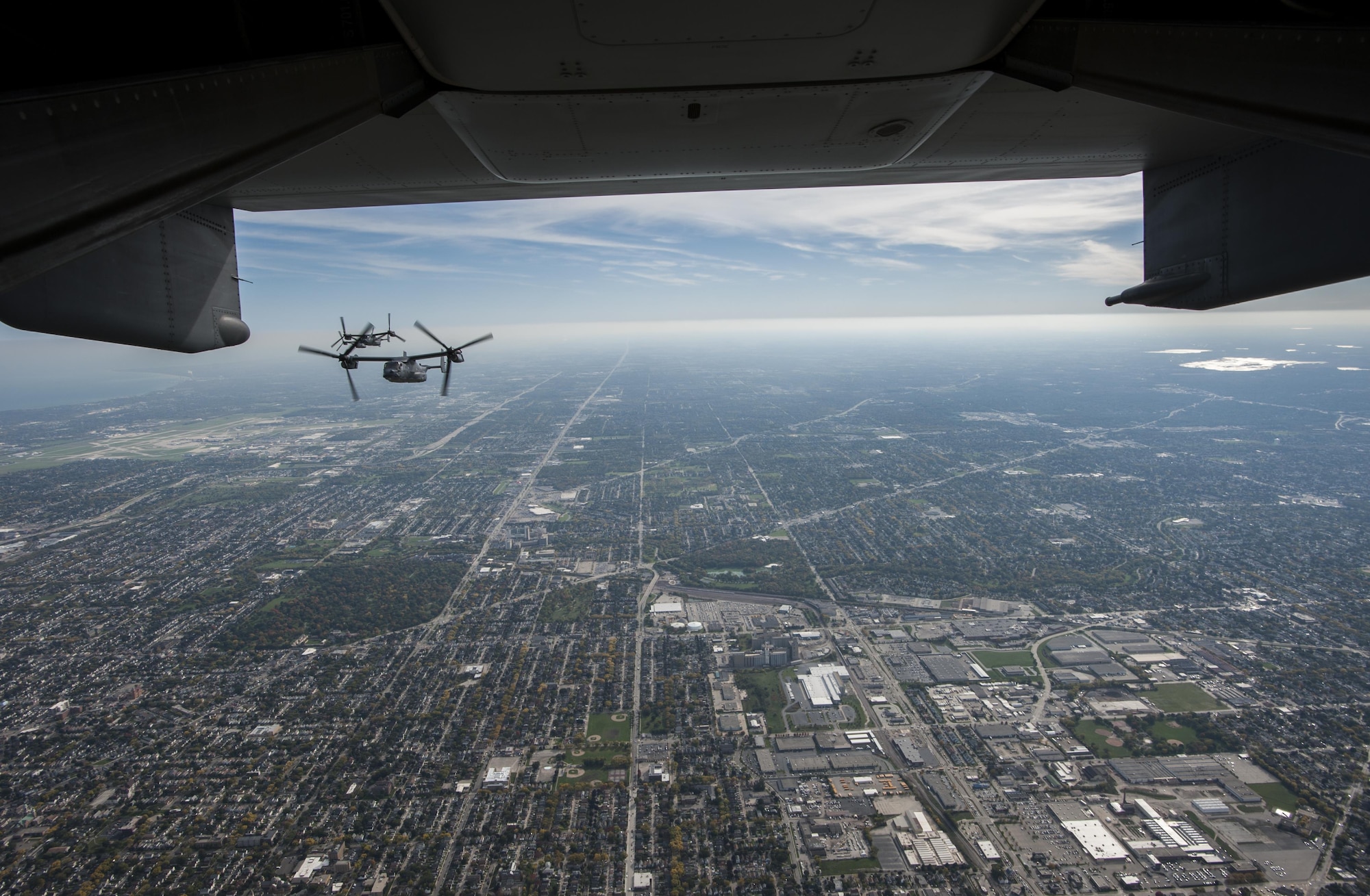 Four CV-22 Osprey aircraft with the 8th Special Operations Squadron from Hurlburt Field, Fla., fly along the Lake Michigan coast, Oct. 14, 2016. The 8th SOS visited the Milwaukee-Green Bay area for a flyover above Lambeau Field Oct. 16 during the Green Bay versus Dallas NFL game. The Osprey is a tiltrotor aircraft that combines the vertical takeoff, hover and vertical landing qualities of a helicopter with the long-range, fuel efficiency and speed characteristics of a turboprop aircraft. (U.S. Air Force photo by Airman 1st Class Joseph Pick)