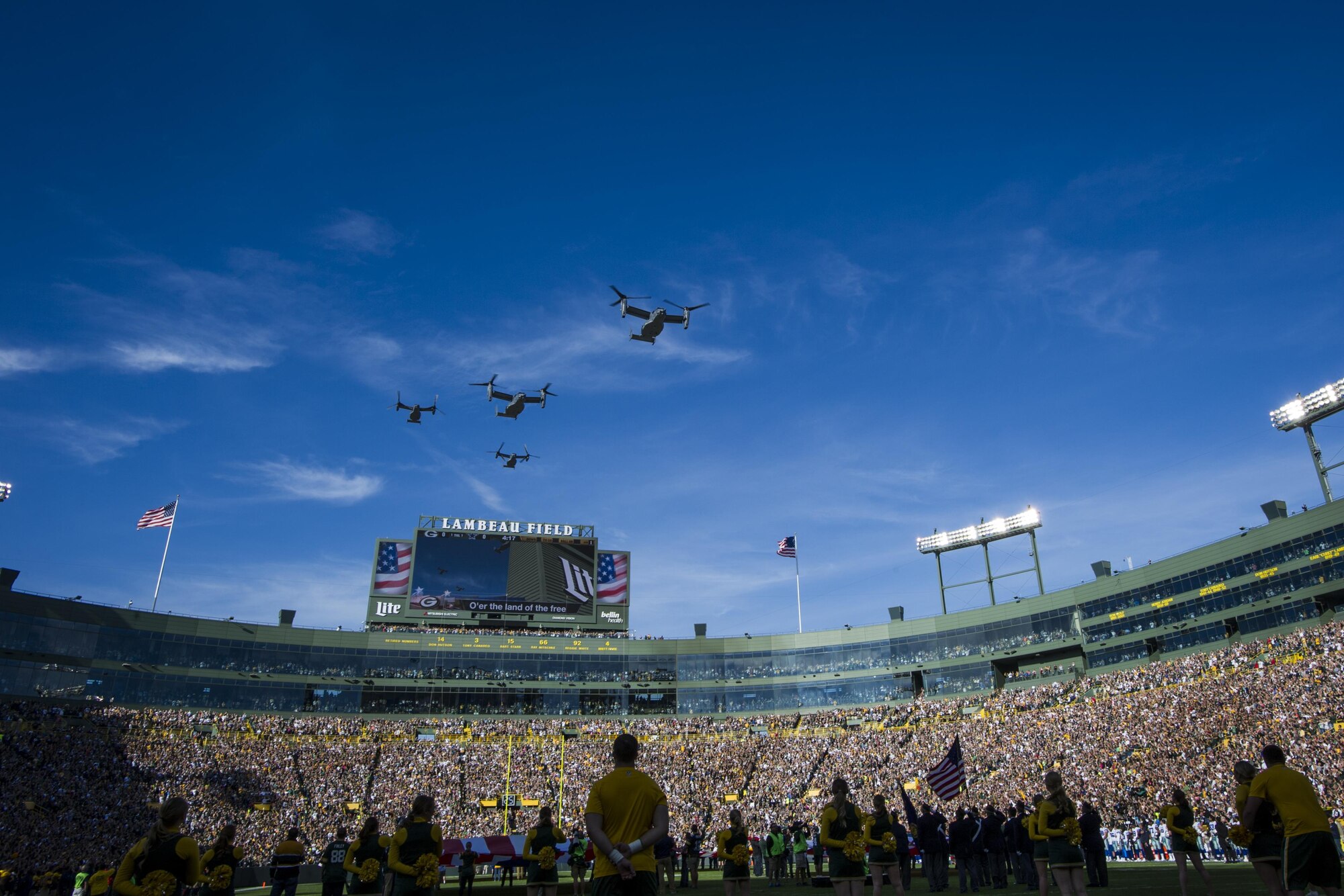Four CV-22 Osprey aircraft with the 8th Special Operations Squadron from Hurlburt Field, Fla., flyover Lambeau Field, Wis., during the final moments of the national anthem, Oct. 16, 2016. The flyover marks the first time that the 8th SOS has conducted a flyover of an NFL game. The Osprey is a tiltrotor aircraft that combines the vertical takeoff, hover and vertical landing qualities of a helicopter with the long-range, fuel efficiency and speed characteristics of a turboprop aircraft. (U.S. Air Force photo by Airman 1st Class Joseph Pick)