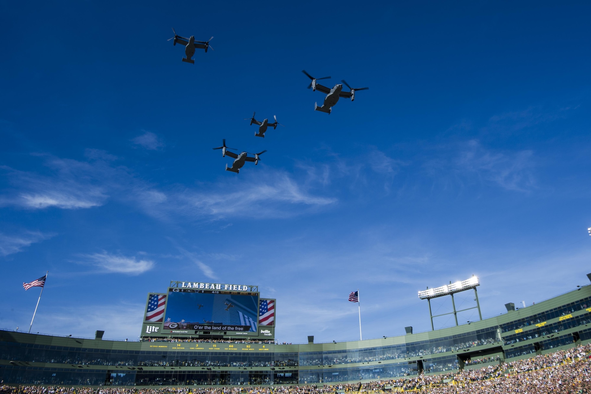 Four CV-22 Osprey aircraft with the 8th Special Operations Squadron from Hurlburt Field, Fla., flyover Lambeau Field, Wis., during the final moments of the national anthem, Oct. 16, 2016. The flyover marks the first time that the 8th SOS has conducted a flyover of an NFL game. The Osprey is a tiltrotor aircraft that combines the vertical takeoff, hover and vertical landing qualities of a helicopter with the long-range, fuel efficiency and speed characteristics of a turboprop aircraft. (U.S. Air Force photo by Airman 1st Class Joseph Pick)