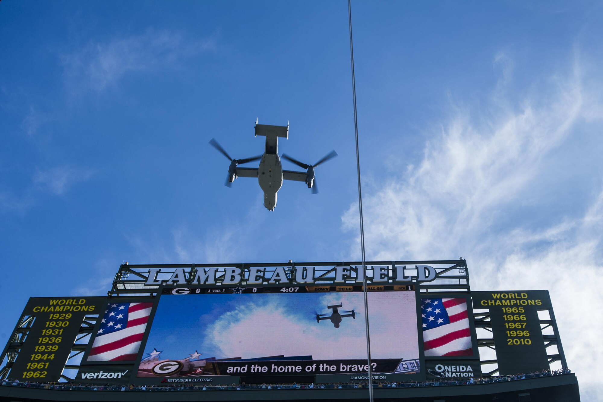 Four CV-22 Osprey aircraft with the 8th Special Operations Squadron from Hurlburt Field, Fla., flyover Lambeau Field, Wis., during the final moments of the national anthem, Oct. 16, 2016. The flyover marks the first time that the 8th SOS has conducted a flyover of an NFL game. The Osprey is a tiltrotor aircraft that combines the vertical takeoff, hover and vertical landing qualities of a helicopter with the long-range, fuel efficiency and speed characteristics of a turboprop aircraft. (U.S. Air Force photo by Airman 1st Class Joseph Pick)