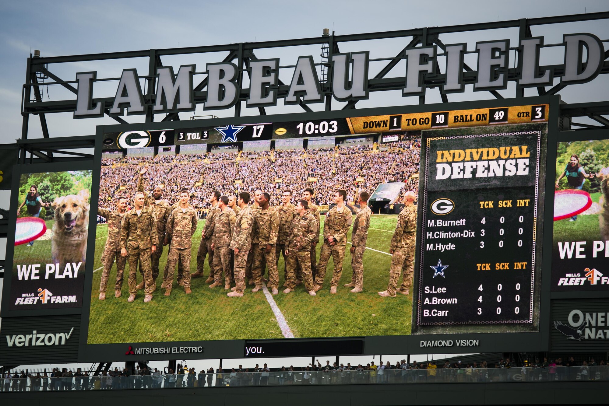 Aircrew with the 8th Special Operations Squadron from Hurlburt Field, Fla., are introduced following the CV-22 Osprey flyover above Lambeau Field, Wis., Oct. 16, 2016. The flyover marks the first time that the 8th SOS has conducted a flyover of an NFL game. The Osprey is a tiltrotor aircraft that combines the vertical takeoff, hover and vertical landing qualities of a helicopter with the long-range, fuel efficiency and speed characteristics of a turboprop aircraft. (U.S. Air Force photo by Airman 1st Class Joseph Pick)