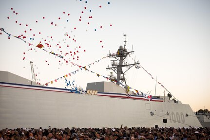 161015-N-AT895-183 BALTIMORE (Oct. 16, 2016) Balloons fly and the crowd applauds as the Navy's newest and most technologically advanced warship, USS Zumwalt (DDG 1000), is brought to life during a commissioning ceremony at North Locust Point in Baltimore. (U.S. Navy photo by Petty Officer 1st Class Nathan Laird/Released)