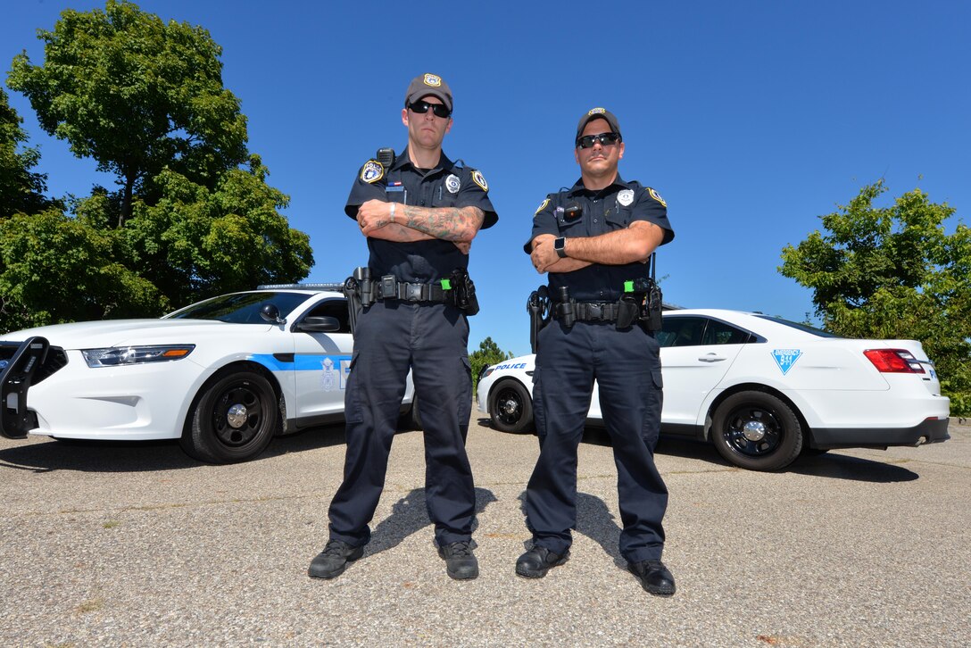 (from left) Officers Jacob Hughett and Adam Cruea, both with the  88th Security Forces Squadron, stand ready to answer any emergency or call for help, at Wright-Patterson Air Force Base, Sept. 12, 2016. Both officers work as GS level employees and are part of a civilian contingent within the 88th SFS. (U.S. Air Force photo/Al Bright)