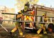 Airmen of the 174th Attack Wing Fire Department ready a ladder for access to the roof of a simulated burning building during an exercise held on Hancock Field Air National Guard Base Oct. 15, 2016. The exercise was part of a unit effectiveness inspection capstone. (U.S. Air National Guard photo by Staff Sgt. Duane Morgan)